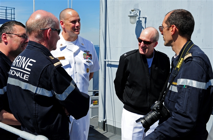 ST. PETERSBURG, Russia  - Capt. Kevin Hill, commanding officer of the guided-missile cruiser USS Normandy (CG 60), second from right and Command Master Chief Phillip Hallford speak with French sailors aboard the French naval vessel De Grasse (D612) in port in St. Petersburg during Exercise FRUKUS 2012. FRUKUS is an annual exercise aimed at improving maritime security through an open dialogue and increased training between the navies of France, Russia, United Kingdom and United States.