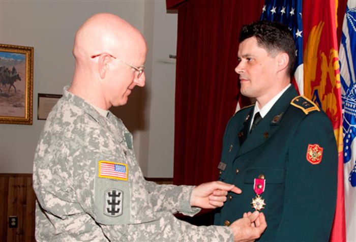 Maj. Gen. Gregg Martin, commandant of the U.S. Army War College, presents Lt. Col. Rajko Pesic, representing the Army of Montenegro, with the Legion of Merit (Degree of Officer) during a ceremony at Carlisle Barracks Monday. Pesic, currently an International Fellow in the Army War College’s Class of 2012, received the award for his achievements serving as Montenegro’s first-ever Defense, Military, Naval, and Air Attache in the United States from 2008 until he arrived at Carlisle Barracks last summer.   