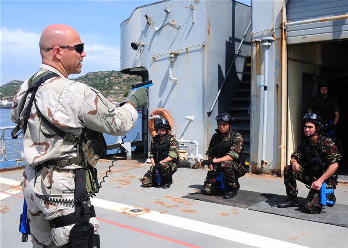 SOUDA BAY, Crete (May 8, 2012) - Moroccan naval forces participate in small-arms training aboard the Hellenic training ship Aris as part of a boarding team exercise during Phoenix Express 2012 (PE12). PE12, a multi-national maritime exercise between Sothern European, North African and U.S. Naval forces, is designed to improve cooperation among participating nations and help increase safety and security in the Mediterranean Sea.