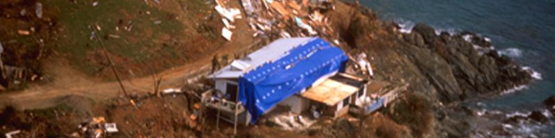 September 15th, 1995. Debris from a destroyed home covers the coastline.