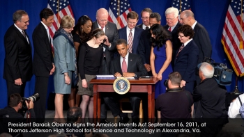 The president signing the bill