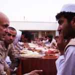 GARMSIR DISTRICT, Helmand province, Afghanistan - U.S. Marine Corps. Lt. Col. Sean Riordan speaks with District Governor Mohammed Fahim during iftar, or "breaking of fast," which is the nightly meal during the month-long Islamic holiday Ramadan, Aug. 8. Riordan, a native of Montclair, Va., is the commanding officer of 1st battalion, 3rd Marines. Marines from 1/3 are regularly invited to Iftar with their Afghan National Army and Police counterparts during Ramadan.