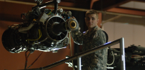Army soldier working on aircraft engine