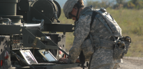 Female soldier repairing