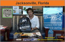 Photo of a man in an office or home, facing the camera, holding a backpack, with signage all around him. His name, from the text over the bottom of the screen, is David Reed, EA conservation coordinator. The headline over the photo reads 'Jacksonville, Florida.'