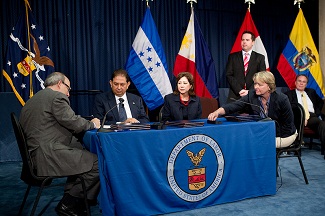 Signing ceremony on Migrant Worker program partnerships, June 11, 2012.  Seated from left: OSHA Assistant Secretary David Michaels,  Ambassador Jorge Ramón Hernández Alcerro of the Government of Honduras, Secretary of Labor Hilda L. Solis and Libby Hendricks of DOL’s Wage and Hour Division.