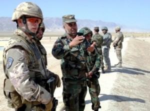 Afghan National Army Maj. Asa Dullah, operations officer, explains the ANA weapons range layout to Canadian Army Capt. Andrew Warlow, a Regional Support Command – North Canadian contingent adviser, Sept. 12, at Camp Shaheen, near Marzar-e-Sharif. The team of Canadian soldiers formally took over the advising mission from the U.S. on Sept. 9. (Canadian Army photo by Cpl. Iain Stroud)