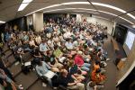 More than 200 Fermilab researchers and staffers crowded into an auditorium at 2 a.m. EDT July 4 and waited for the latest announcement regarding the Higgs boson. 

When CERN Director-General Rolf-Dieter Heuer said the words - "I think we have it" – the Fermilab crowd erupted into applause. 

Fermi National Accelerator Laboratory and Brookhaven National Laboratory are the host laboratories for the U.S. contingents of the Large Hadron Collider (LHC) experiments that found the Higgs boson-like particle. They and researchers from Argonne National Laboratory, Lawrence Berkeley National Laboratory and SLAC National Accelerator Laboratory are among the 1,700 scientists, engineers, technicians and graduate students from the United States that helped design, build and operate the LHC accelerator and particle detectors, and analyze the data from the collisions. Read the story: <a href="http://energy.gov/articles/last-piece-puzzle-celebrating-higgs-boson">The Last Piece of the Puzzle: Celebrating the Higgs Boson</a> | Photo courtesy of Fermilab