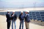 Secretary of the Interior Ken Salazar speaks with First Solar and Enbridge leadership at the Enbridge Silver State North solar project in Nevada. | Photo courtesy of Interior Department, credit Tami A. Heilemann.