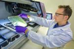 A researcher at the Joint Bioenergy Institute at Berkeley National Lab chooses bacteria colonies in their efforts to create a game-changing biofuel from sustainable, energy-dense plants, such as switchgrass. The JBEI is one example of the ability for Energy Department labs to form scientific partnerships designed to hurdle an energy barrier with transformative technology. | Photo courtesy of Berkeley National Lab.