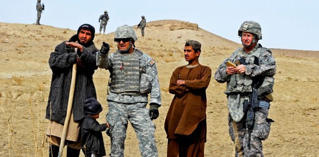 Army soldiers gather intel from an Afghani farmer