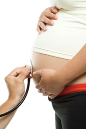 Photo: A stethoscope listening to a pregnant stomach