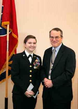 Emmalee Mariner, a junior at Anderson County High School, earned first place in the 2010 ORNL Veterans Day Essay Contest. She is pictured with Jim Roberto, ORNL’s associate laboratory director for Graduate Education and University Partnerships. (ORNL photo) 