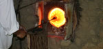 Photo of glass-blowing at the Jamestown Glasshouse