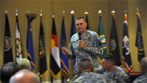 Brigadier Gen. Terry Ferrell, commanding general of the National Training Center, Fort Irwin, addresses the audience during the 23rd Annual Community Military Mixer at the Sandy Basin Community Center, Sept. 26. The military mixer provided new residents and employees the chance to socialize, network and relax in a friendly environment, while familiar faces strengthened their ties among service members and the High Desert community at large.