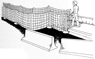 Figure 10-7. GOOD DESIGN: Mesh fencing and temporary ramps are critical features at construction sights.
