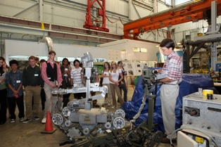 Oak Ridge National Laboratory engineer Mark Bradley explains ORNL’s robotics research to students from the Tennessee Governor’s Academy for Math and Science. (ORNL photo by Jason Richards). 