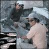 Suarez sisters working at fossil-discovery site; inset of jawbone fossil.