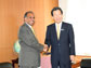 Photo of NSF Director Suresh and MEXT Minister Hirofumi Hirano shaking hands.