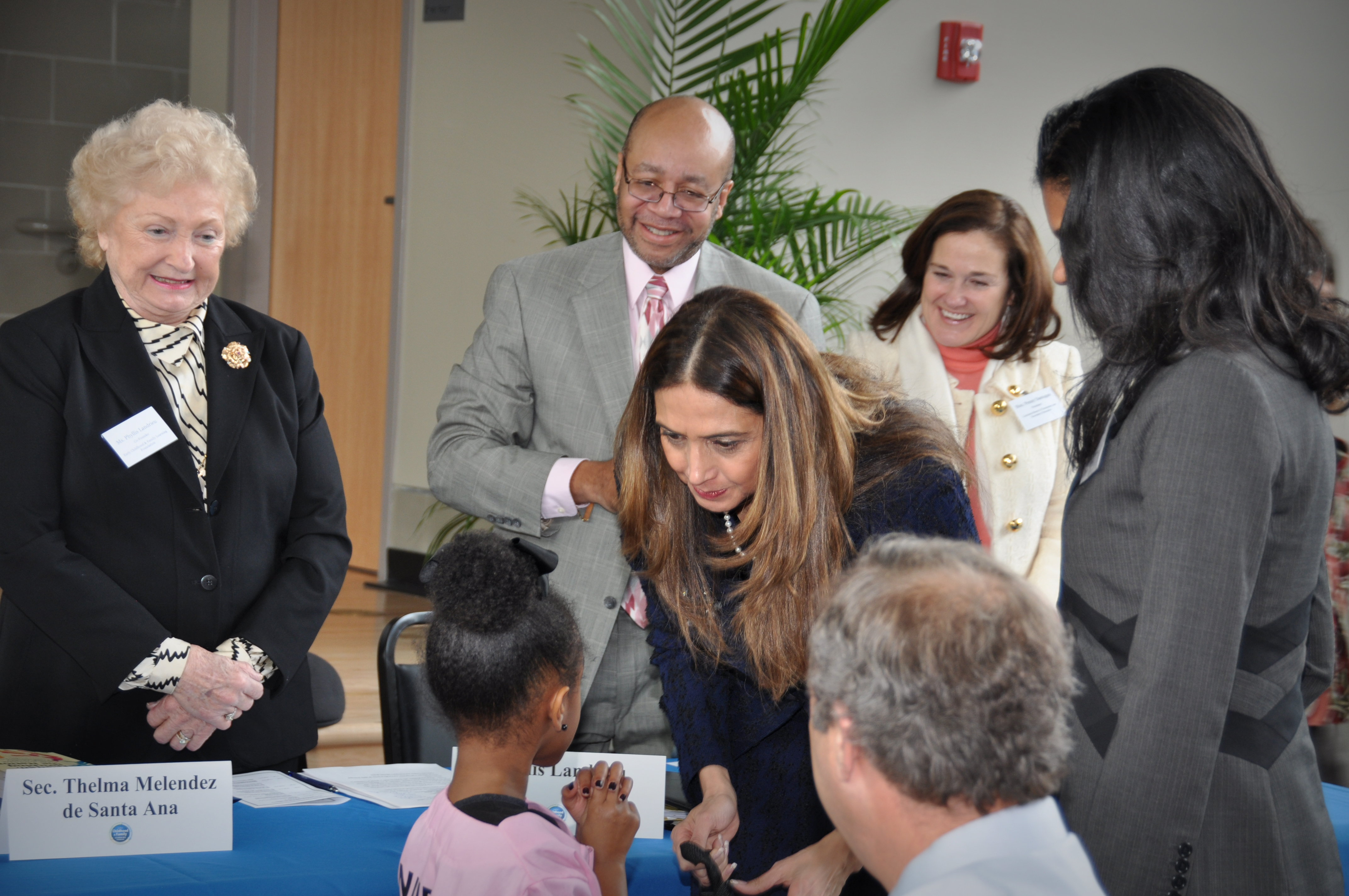 Dr. Melendez greets a student speaker at the Mahalia Jackson Early Childhood and Family Learning Center.