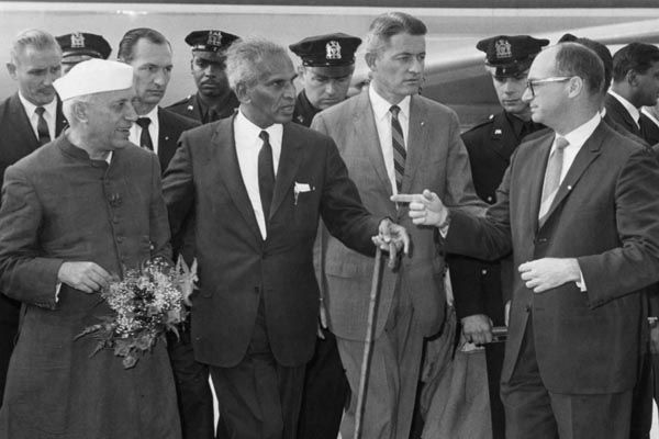 September 25, 1960:  Office of Security Special Agent James McDermott (center, right) provides protection for Prime Minister Jawaharlal Nehru of India, as he arrives in New York City to attend the United Nations General Assembly session. India's Foreign Minister V. Krishna Menon (center with cane) escorts the Prime Minister. (Source: United Press International)