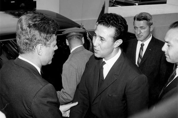 October 15, 1962:  SY Special Agent James McDermott (at rear, right) looks on as President John F. Kennedy welcomes Prime Minister Ahmed Ben Bella of the Democratic Republic of Algeria to the White House.  (Source: Private Collection)