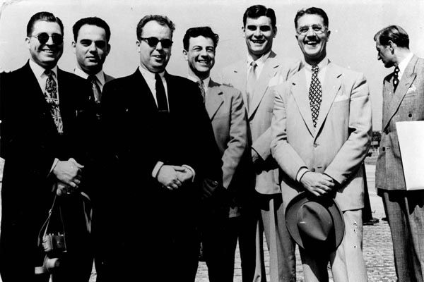 1952:  Meeting in Vienna are Regional Security Officer Mike Lustgarten (3rd from left), his Assistant Jim Trout (center), Special Agent Leo Crampsey (3rd from right), and Special Agent Frank Madden (second from right). (Source: U.S. Department of State)