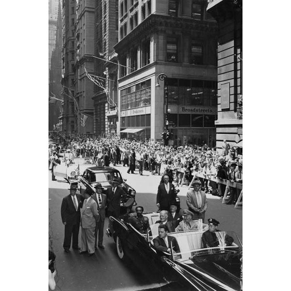 Ethiopian Emperor Haile Selassie waves to the crowd from the rear seat of his motorcade in New York City, as security detail Special Agent John F. McDermott (front seat passenger) peers over his right shoulder, June 1, 1954. (Source: Private Collection)
