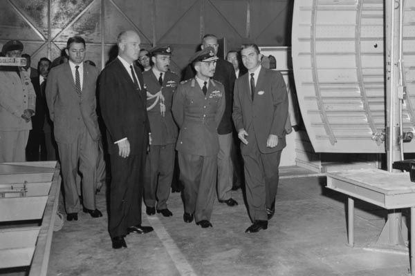 1959:  His Majesty King Hussein of Jordan, center front, with Special Agent James M. McDermott (left in light-colored suit) tour a U.S. facility. (Source: Private Collection)