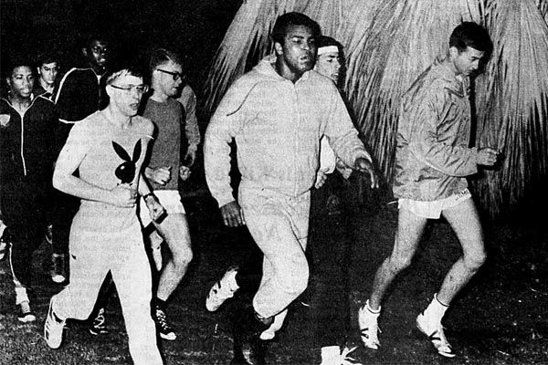 Fall 1974:  U.S. heavyweight boxing champion Muhammed Ali (center) takes an early morning jog with the U.S. Marine Security Guard detachment stationed at the U.S. Embassy in Beirut.  Ali visits Lebanon during a personal tour of several Arab nations.  (Source: Associated Press/Harry Koundakjian)