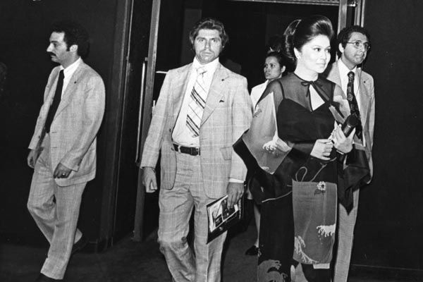 Circa 1975:  Special agents protect Philippines First Lady Imelda Marcos at the Lincoln Center in New York City. (Source: Private Collection)