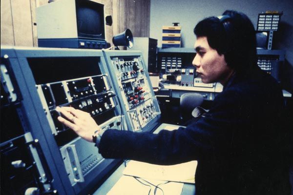 1986:  A DS security engineering officer monitors radio signals from unauthorized sources at a Department of State facility. These monitoring systems were the last generation of vacuum-tube receivers used by DS. (Source: DS Records)