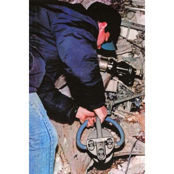 February 29, 1993:  A DS special agent operates an explosive detector inside a crater left by the 1993 World Trade Center bombing three days earlier, in New York City. Diplomatic Security assists the New York Police Department and FBI in the bombing investigation, helping to identify terrorists responsible for the attack. (Source: Bureau of Alcohol, Tobacco, and Firearms)  