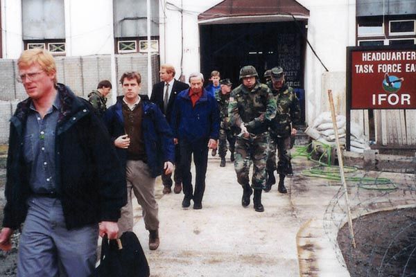 February 1996:  U.S. Secretary of State Warren Christopher (rear center) visits the NATO-led Implementation Force headquarters (IFOR) in Bosnia, surrounded by a protective detail of DS special agents.  (Source: DS Records)