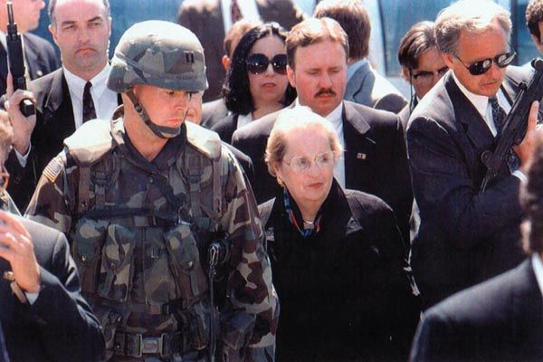 June 1997:  DS special agents  (left, center, and right) provide security for U.S. Secretary of State Madeleine Albright during her visit to Brchko, Bosnia. (Source: Private Collection)