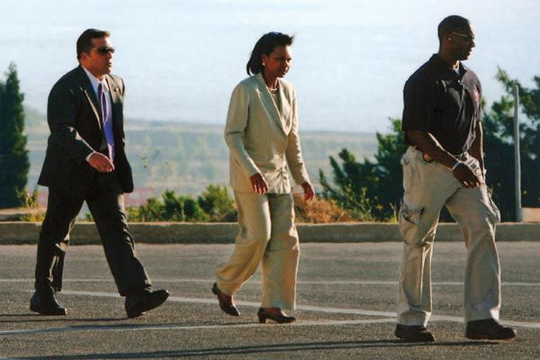 July 24, 2006:  DS special agents provide security for U.S. Secretary of State Condoleezza Rice as she walks toward a waiting U.S. Marine CF53 Sea Stallion helicopter on the grounds of U.S. Embassy Beirut.  Secretary Rice is on a mission to Lebanon to launch diplomatic efforts aimed at ending combat between Israeli ground forces and Hezbollah. (Source: Associated Press)