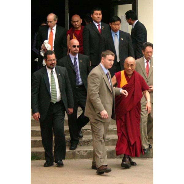 May 1, 2007:  DS special agents protect His Holiness the Dalai Lama as he leaves a speaking engagement at Rice University in Houston, Texas. (Source: U.S. Department of State)