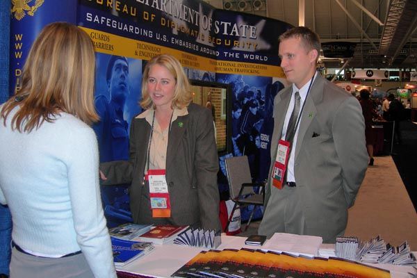 Oct. 15, 2006: DS special agents talk with an interested visitor at the annual convention of the International Association of Chiefs of Police in Boston.  (Source:  U.S. Department of State)