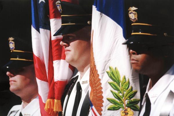 October 17, 2005:  Bureau of Diplomatic Security uniformed protective officers stand at attention at the National Law Enforcement Officers Memorial in Washington, DC.  (Source: Associated Press)