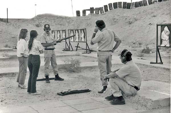 1985: Three special agents with the SY Mobile Training Team (wearing ball caps) conduct a weapons familiarization firing exercise for U.S. Embassy Kuwait staff.  (Source:  U.S. Department of State)