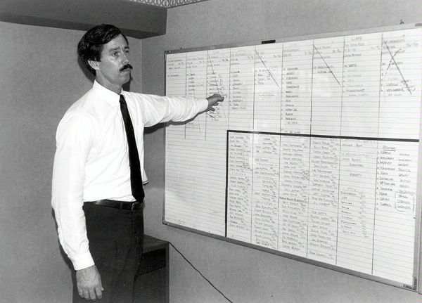 Circa September 1987: A DS protection chief reviews dignitary protection details at the DS command center in Manhattan. DS provided 25 protective details each day of the annual United Nations General Assembly. (Source:  Private Collection)