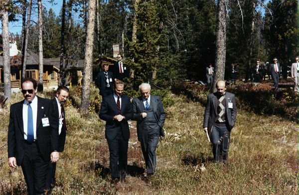 U.S. Secretary of State James Baker, III, and Soviet Foreign Minister Eduard Shevardnadze as they engage in bilateral consultations at a private lodge near Jackson Hole, Wyoming.  DS Special Agents John Prendergast (left), Tony Deibler (extreme right rear in light suit), and Chris Liebengood (second from right at rear).  U.S. and Soviet interpreters (second from left, and right foreground.