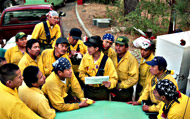 Firefighters in morning briefing.