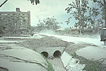 Ash-covered drainage canal, Philippines