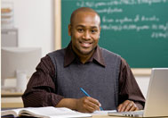 picture of a teacher at a desk