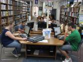 group of library patrons at computer workstations