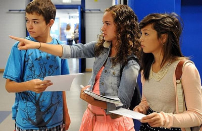 Heidelberg (Germany) High School senior Kylee Miller points the way to a classroom for her freshman brother, CJ, and Summer Warren, also a freshman. Monday was the first day of the final school year at HHS.