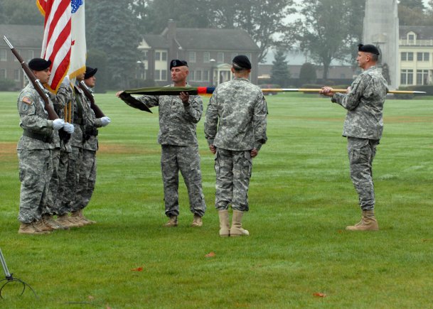 I Corps Commanding General, Lt. Gen. Robert Brown (right) holds the 7th Infantry Division colors, as Command Sgt. Maj. Delbert D. Byers, left, prepares to uncase them with Maj. Gen. Stephen R. Lanza, Oct. 10, 2012, during the 7th Infantry Division reactivation ceremony at Watkins Parade Field, Joint Base Lewis-McChord,Wash. Lanza and Byers will lead the division and its five subordinate brigades, which consist of nearly 18,000 soldiers. The brigades are as follows: 2nd Stryker Brigade Combat Team, 2nd Infantry Division; 3rd SBCT, 2ID; 4th SBCT, 2ID; 16th Combat Aviation Brigade; and 17th Fires Brigade.