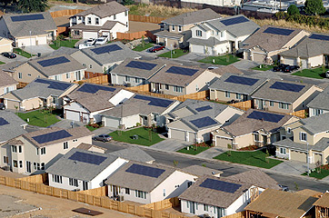 Arial photo of Premier Gardens Zero Energy Home Community homes showing photovoltaic panels on the roofs