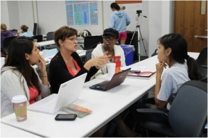 Students working together on research projects at UT Austin.